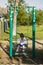 Little girl swinging. Happy laughter baby girl on swing