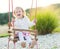 Little girl swinging on a playground. Childhood, Freedom, Happy Summer Concept