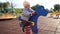 Little girl swings on a spring swing in the playground