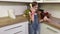 Little girl talking on retro phone in kitchen