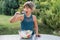 Little girl is tasting fresh salad