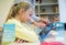 Little girl with teacher and tablet pc at school