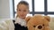 Little girl with teddy bear.The concept of a happy childhood, ch