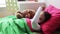 Little girl with teddy bear sleeping at home