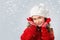 Little girl think about Santa on snow background