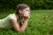 Little girl thinking in a park