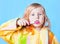 Little girl thinking while washing teeth