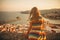 Little girl on the top of Peniscola, admiring amazing summer sunset