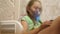 Little girl treated with an inhalation mask on her face in hospital. child with a tablet is sick and breathes through an
