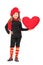 Little girl in trendy clothes holding a big red heart