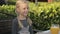 Little girl with two plaits sitting at the table