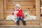 A little girl with two puppy Golden Retriever.