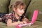 Little girl typing on laptop