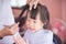 Little girl unhappy with first haircut by hairdresser