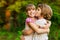 Little girl is very happy that she has sister. Loving sister hugging cute little girl showing love care support. Sincere warm