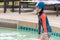 Little girl very tired in swimming training pool