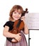 Little girl with violin posing