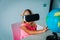 Little girl with virtual reality googles on distant learning at home