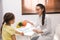 Little girl visiting professional nutritionist