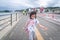 Little girl is walking on the beach side on Toba island, Japan