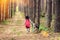 Little girl walking with big dog