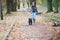 Little girl walking with her dog