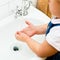 Little girl washing hands