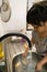 Little girl washing some dishes in her home kitchen