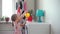 Little Girl Watering Flowers at Home