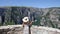 Little girl waves with a Greek flag on Vikos gorge
