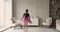 Little girl wear pink fluffy skirt dancing in living room