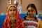 Little girl wearing colorful Omani dress in Muscat festival