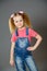 Little girl wearing jeans overalls