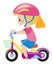 Little girl wearing pink helmet riding bike