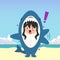 little girl wearing a shark costume character got shocked and pointed to something isolated on a beach background. little girl