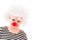 Little girl in white curly clown wig and red nose