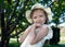 Little girl in a white dress and panama portrait