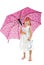 Little girl in white dress with pink umbrella