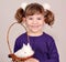 Little girl and white dwarf bunny pet