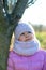 Little girl in winter season with hat thinking