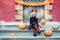 little girl in witch costume celebrate Halloween outdoor and have fun