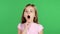 Little girl yawns. Green screen