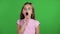 Little girl yawns. Green screen. Slow motion