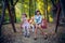 Little girlfriends on swing in park