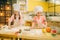 Little girls chefs with rolling pins, funny bakers