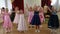 Little girls dance and sing the song. A morning performance in kindergarten