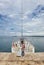 Little girls in front of yacht on pier of coastal town Rovinj, Istria, Croatia
