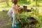 Little girls gardening in urban community garden