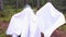 Little girls in a ghost costume in forest. Halloween celebration holiday. Funny smiling grimace