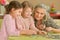 little girls with grandmother collecting puzzles